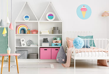 Discover the best white-themed kids room interior designers in Hyderabad featuring a cozy bed and open white shelves to transform your childs space into a dream