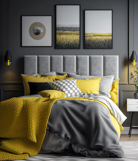 A Bedroom interior design in Bangalore that includes mustard yellow and gray sheets to create a vibe.